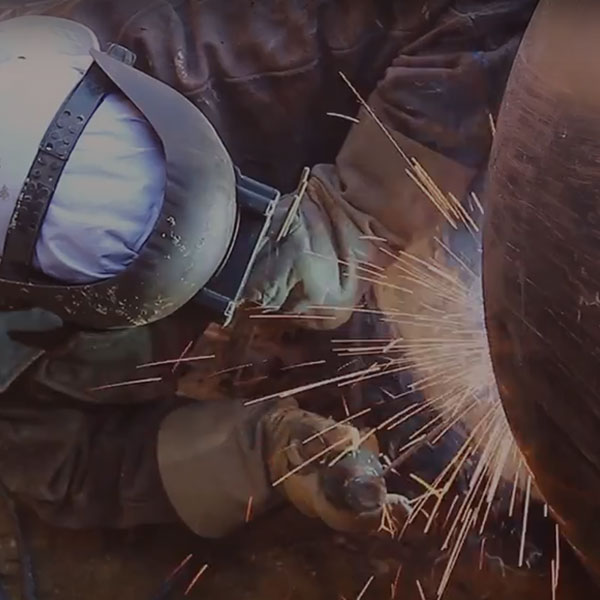 Man welding pipe